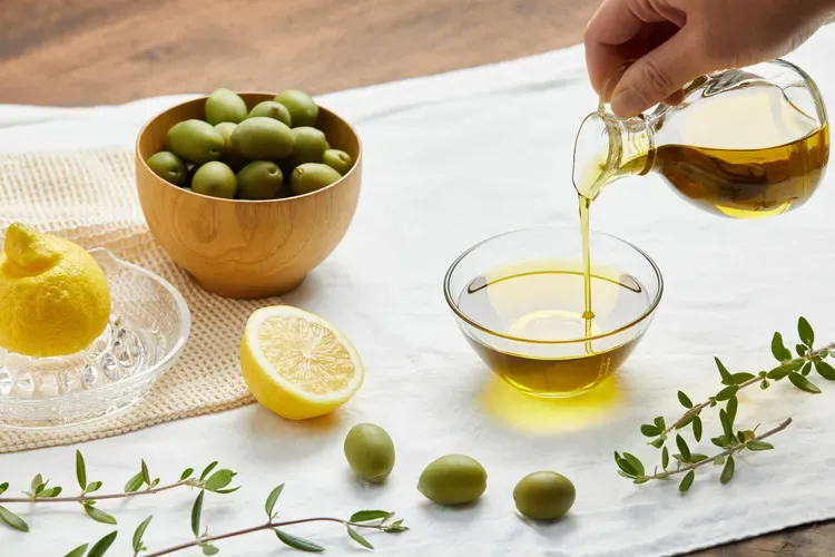 Health-GettyImages-OliveOilLemonShot-75b3f4357c124f9f85468fcaeaf359db.webp