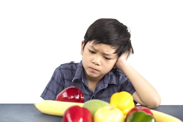 asian-boy-is-showing-dislike-vegetable-expression-white-background-768x512.jpg